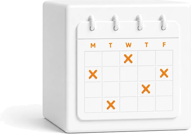 A white desk calendar with days marked off